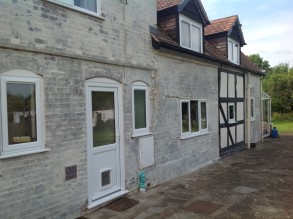 Deteriorated farm house walls as a result of damp penetration